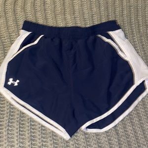 These are navy underarmour shorts with pockets and adjustable string inside!